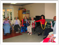 Six seniors sit'n'dancing holding hands