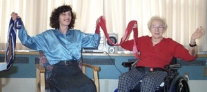 two women participating in a sit'n'dance class